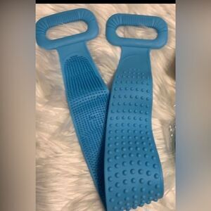 Exfoliating silicone blue back scrubber for shower with hook to hang in shower
